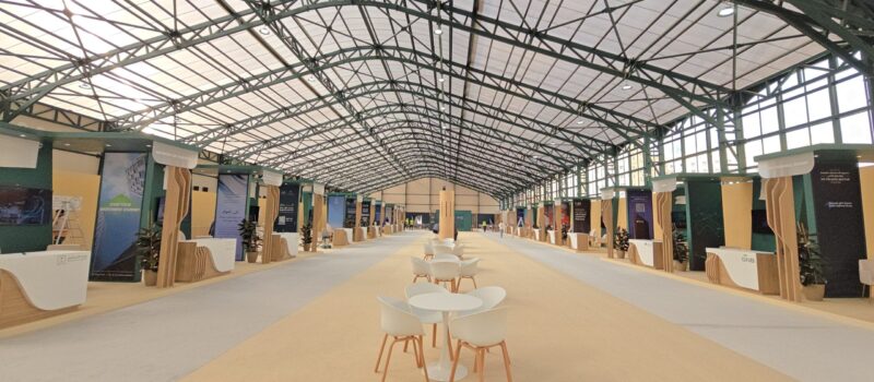 Alt Text: *A large expo center featuring DOMER CONTIROOF translucent polycarbonate panels, providing natural, evenly diffused daylight across the spacious interior.*